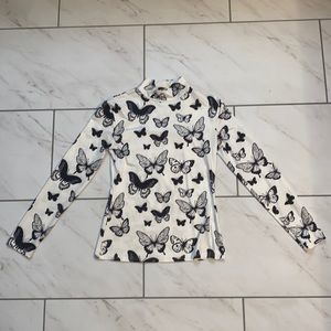 Super cute butterfly shirt. Never worn.